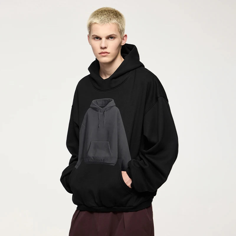 Model wearing the black Minimalist Utility Hoodie 