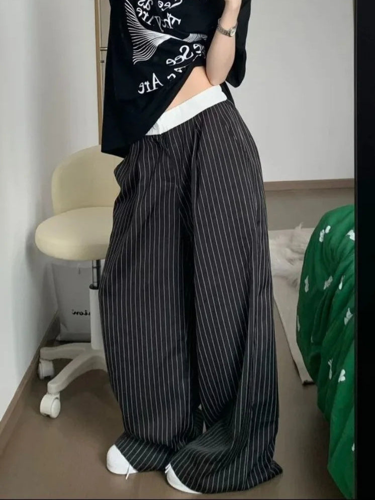 Model wearing the black Pinstripe Baggy Pants