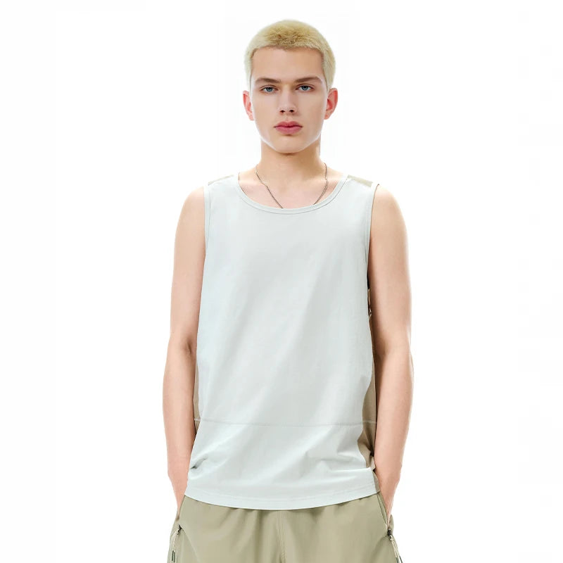 Model wearing the white Urban Edge Tank T-Shirt in a gray background