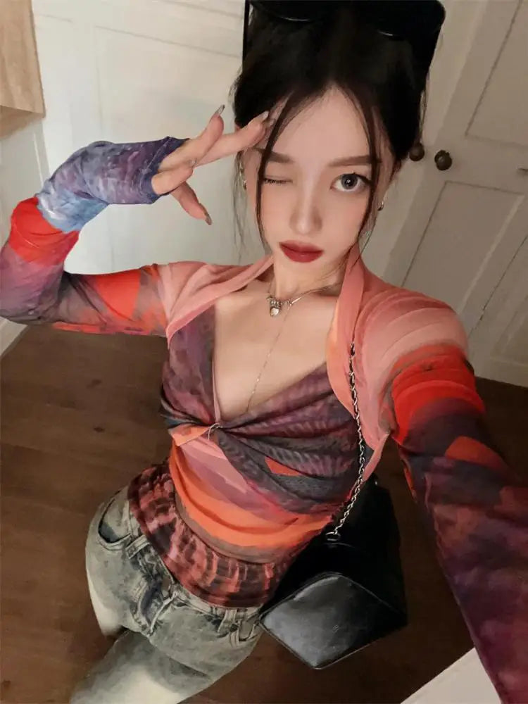 Model wearing the orange Mesh Long Sleeve Top