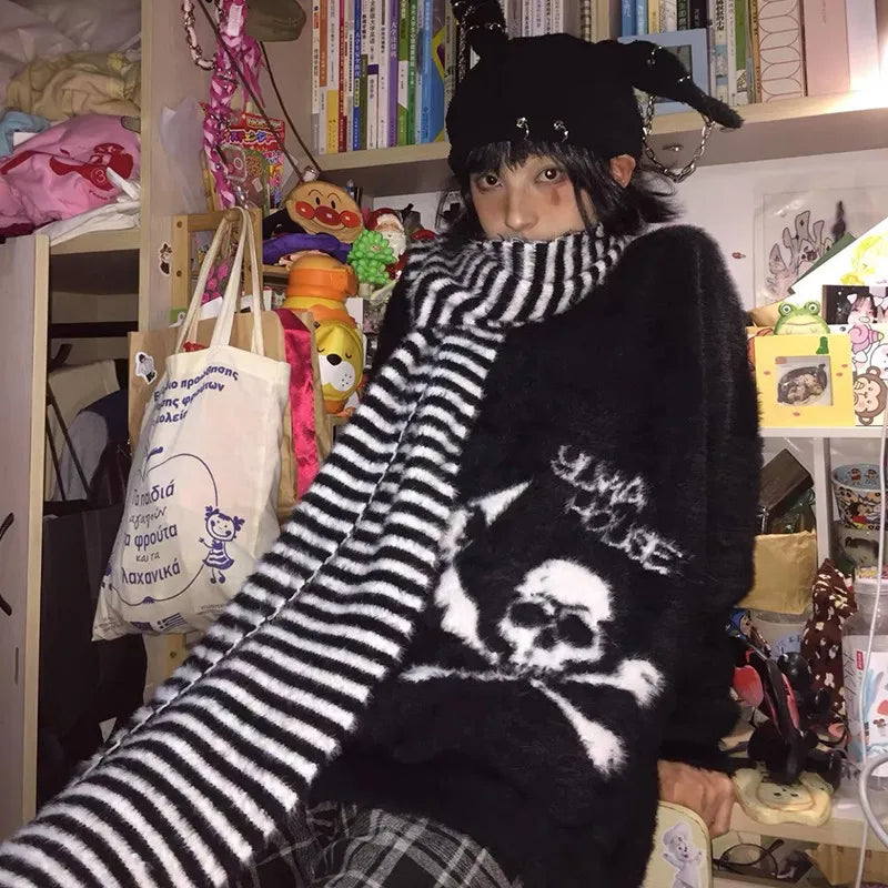 Modern wearing the black Skull Embrace Sweater