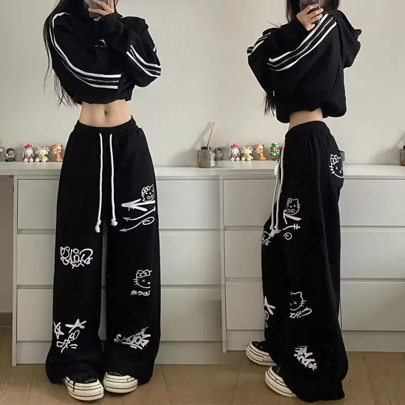 Model wearing the black Y2K Graffiti Flow Pants