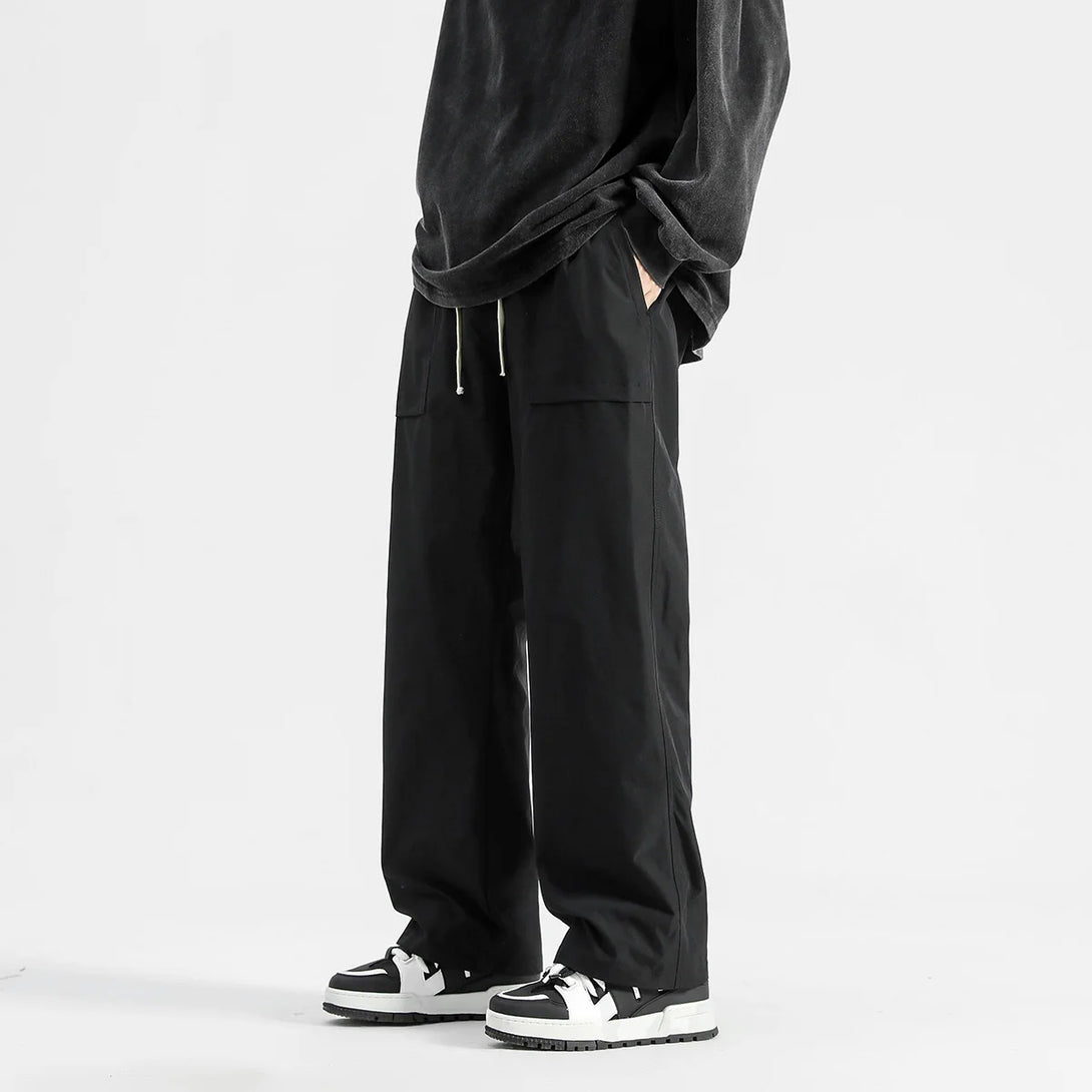 Model wearing the black Wide-Leg Drawstring Cargo Pants