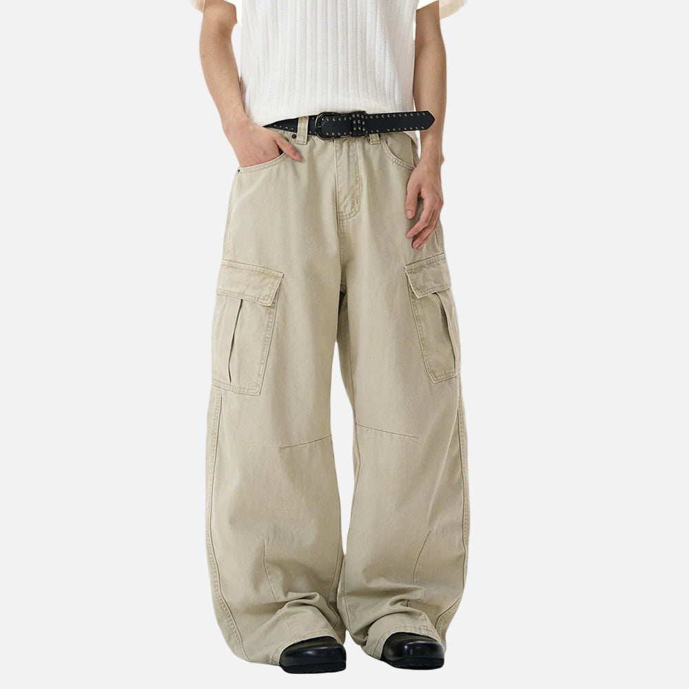 Beige cargo pants worn by a person on a white background