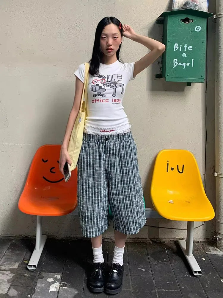 Model wearing the white Graphic Office Lady T-Shirt