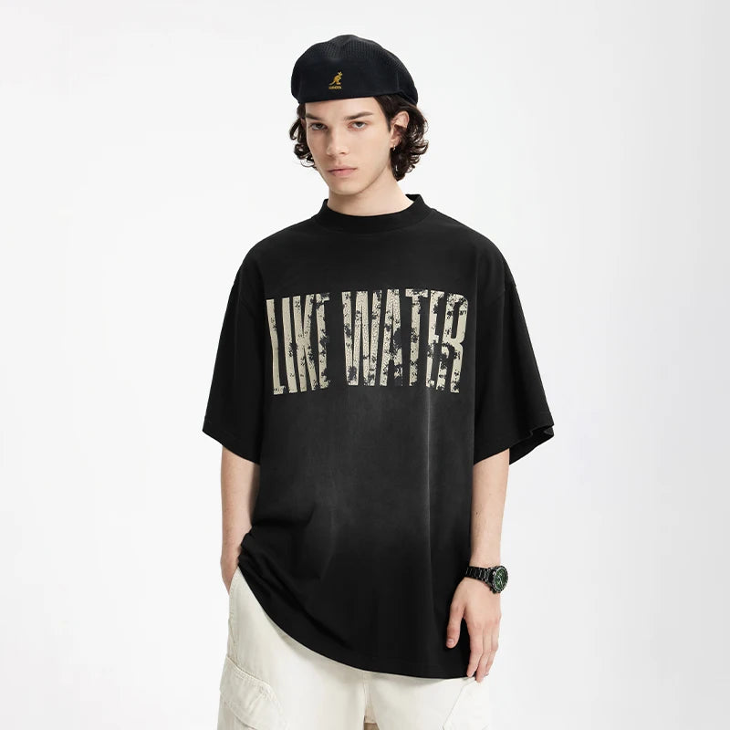 Model wearing the black LIKE WATER T-Shirt