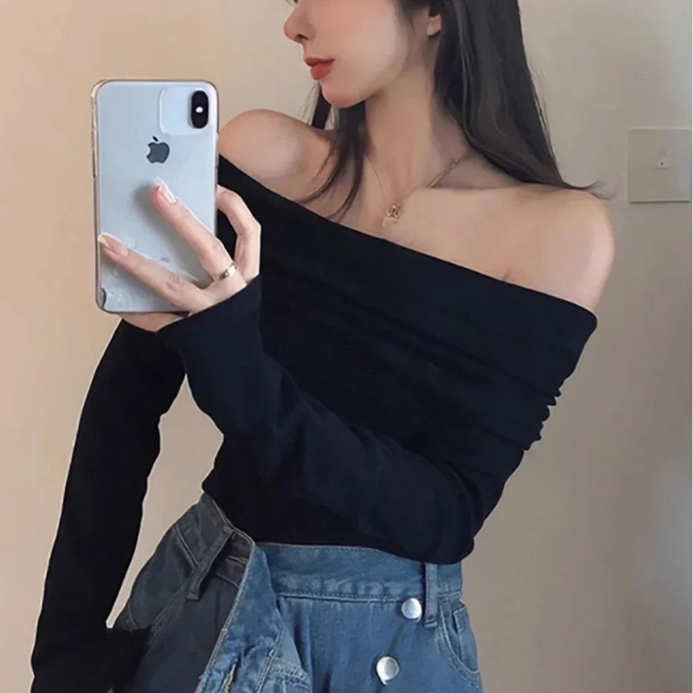 Model wearing the black Off-Shoulder Long-Sleeve Top