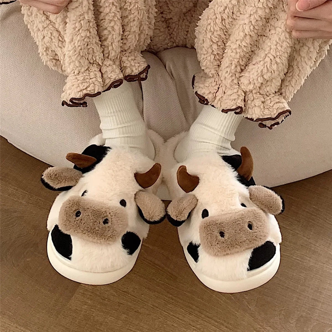 Model wearing the white Cow Slippers