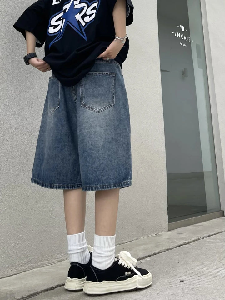 A model wearing the Y2K Baggy Vintage Women's Jorts from DAXUEN while displaying the back view of the item