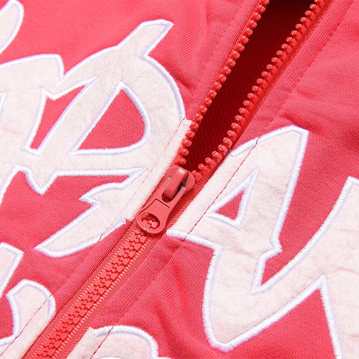 the zipper of the pink Finger Print Oversized Hoodie 