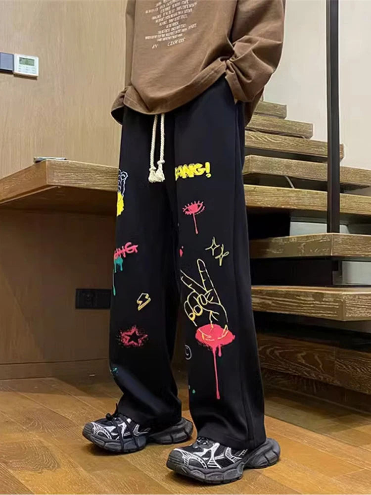 Model wearing the black Y2K Baggy Graphic Sweatpants