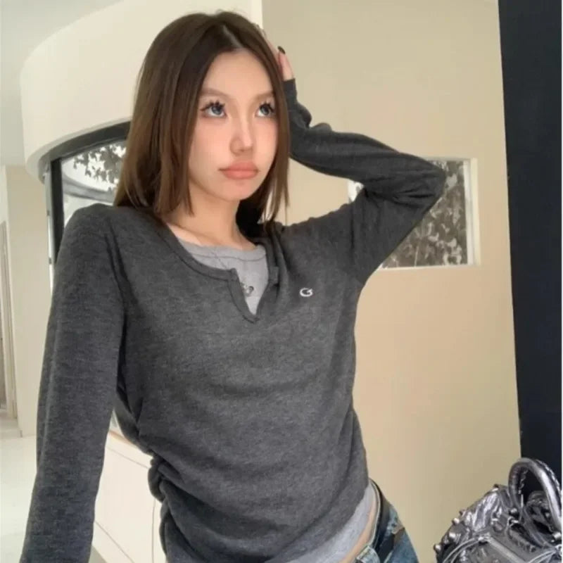model wearing the gray Long-Sleeve Logo T-Shirt
