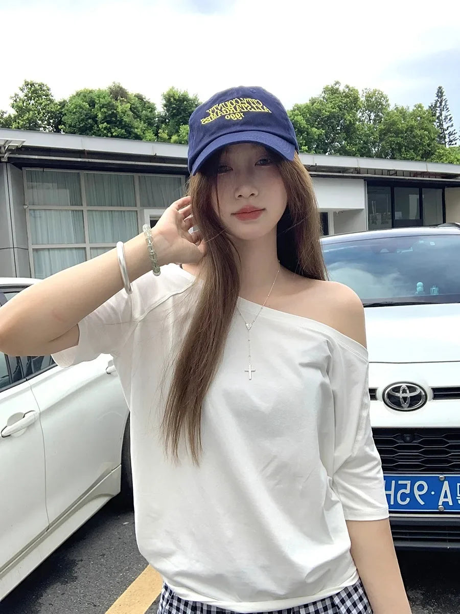 Model wearing the white Relaxed Off-Shoulder T-Shirt 