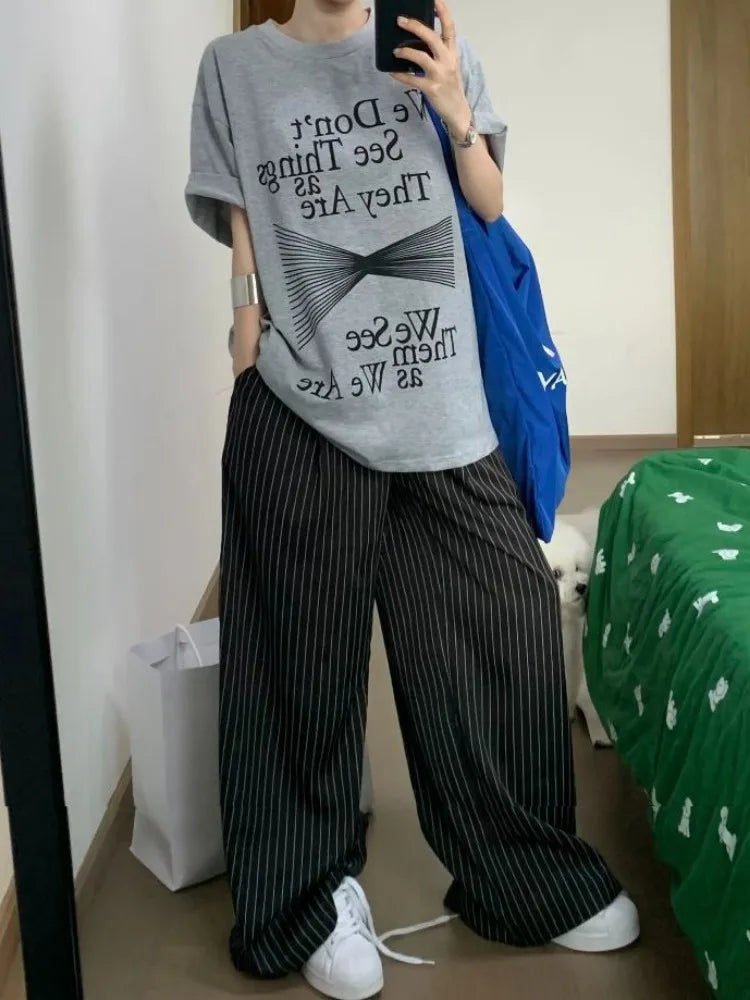 Model wearing the black Pinstripe Baggy Pants