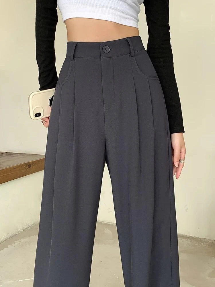 Model wearing the gray High-Waisted Wide-Leg Pants