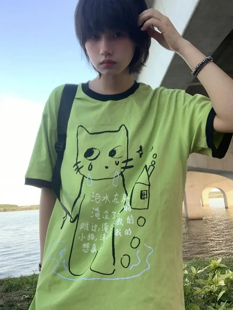 Model wearing the green Whimsical Kitty T-Shirt
