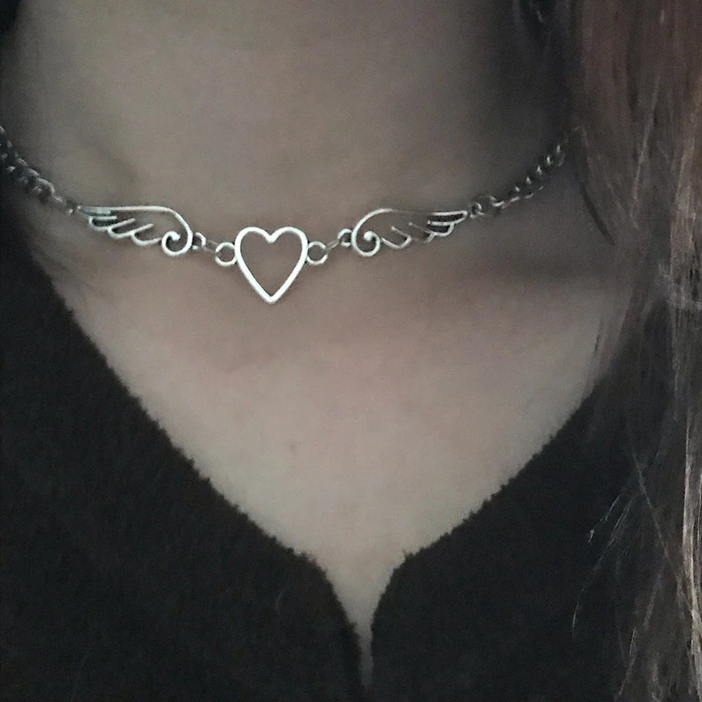 Model wearing the heart wings Starlit Dream Necklace 