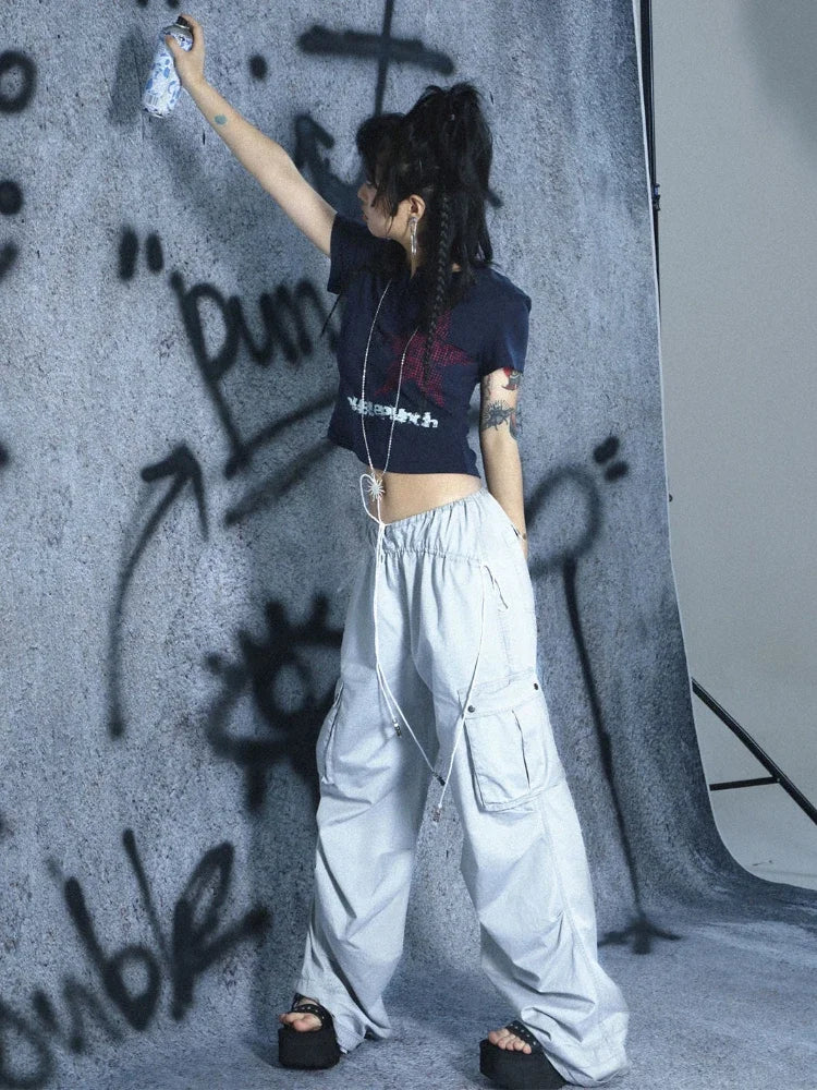 Model wearing the dark blue Cropped Graphic T-Shirt