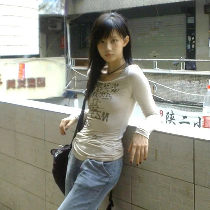Model wearing the gray Long-Sleeve Graphic T-Shirt