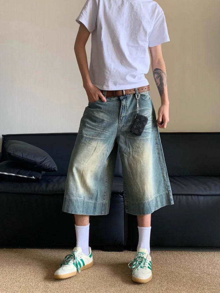 A model wearing the Washed Blue Wide-leg Jorts from DAXUEN