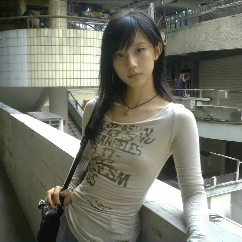 Model wearing the gray Long-Sleeve Graphic T-Shirt