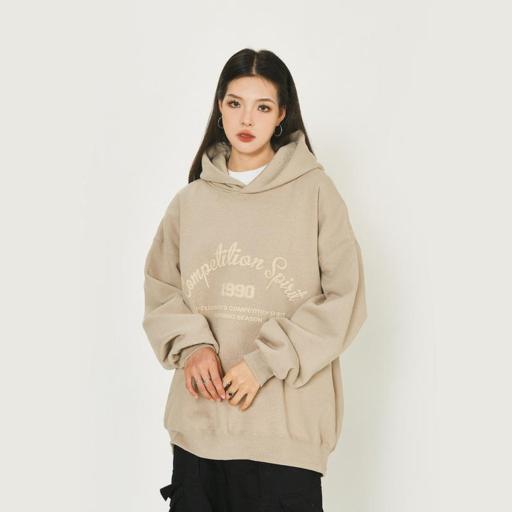 Model wearing the camel Loose Retro Endless road Hoodie in a gray background 