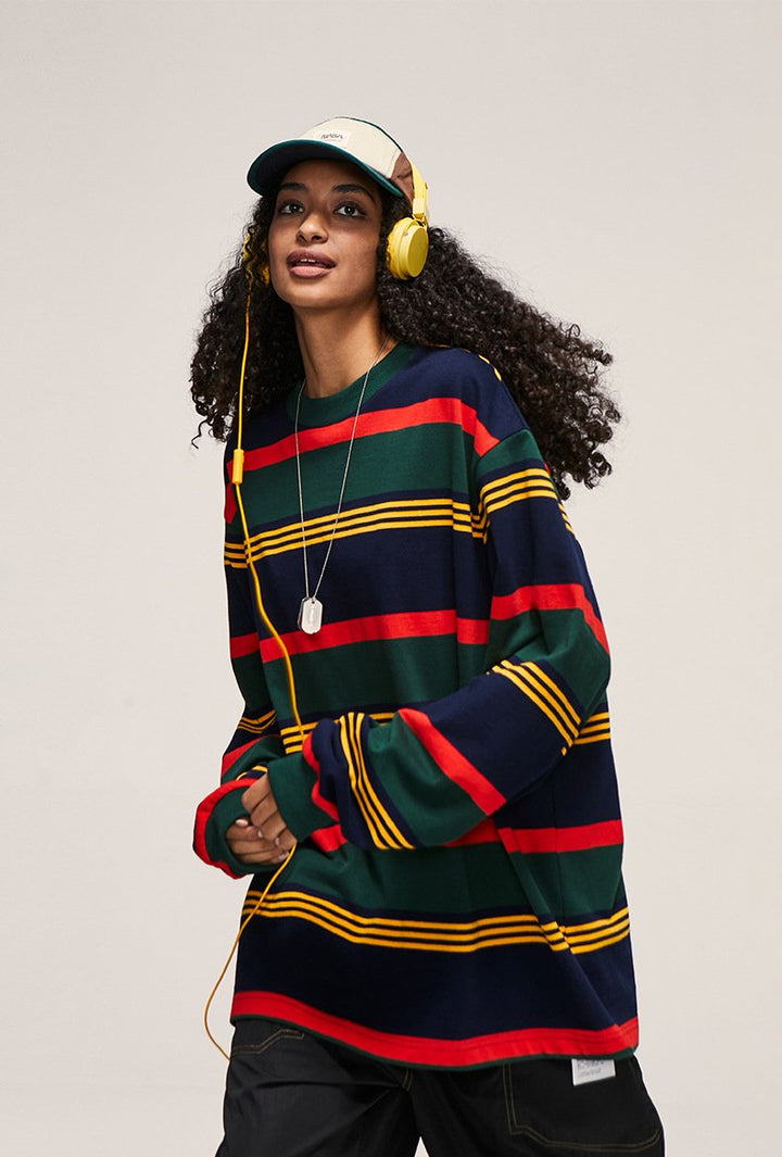 A model wearing the green Contrast Striped Loose Long-sleeved T-shirt from DAXUEN.