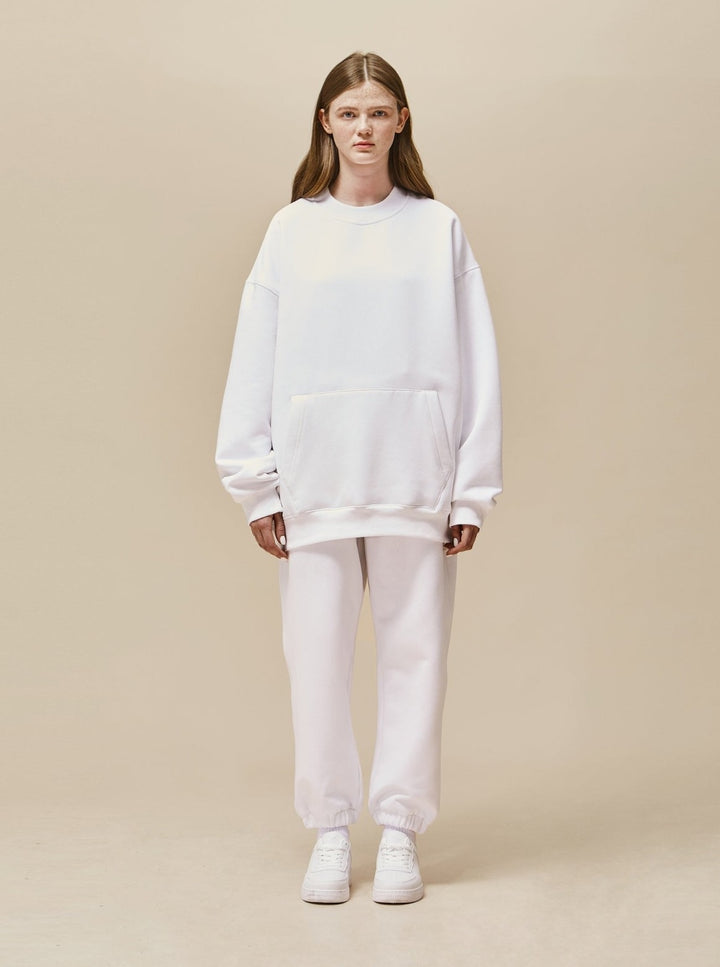 A girl wearing white Explorer Tracksuit front view