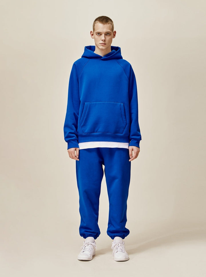 A guy wearing blue explorer tracksuit front view