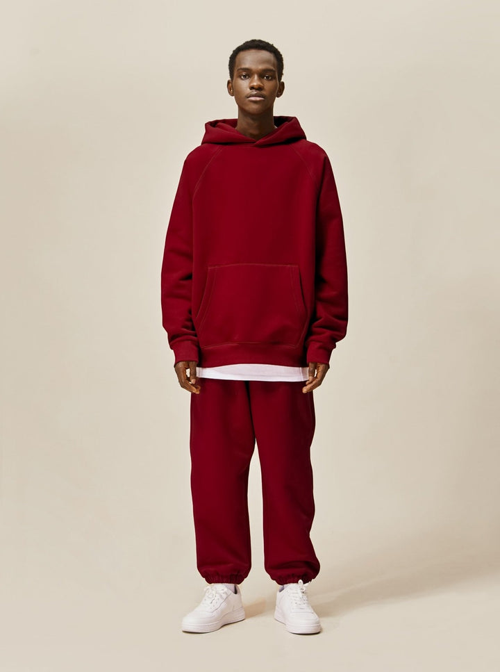 A guy wearing red Explorer Tracksuit front view