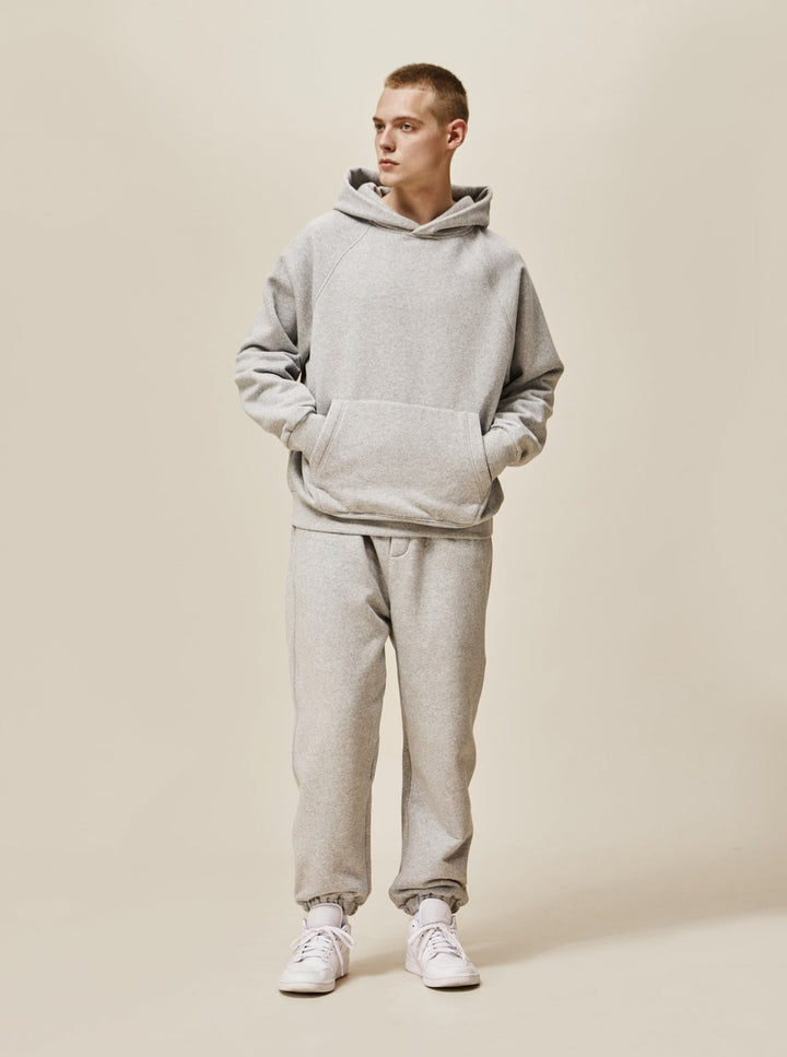 A guy wearing grey Explorer Tracksuit front view
