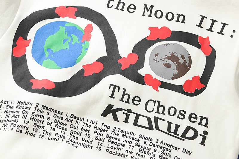 details of the white The Chosen Kid Cudi Hoodie showing the the earth and the moon within 2 cycles
