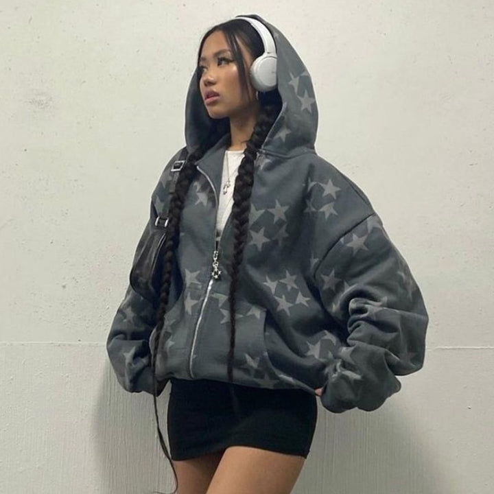 A girl posing while wearing the gray Vintage Star Graphic Hoodies 