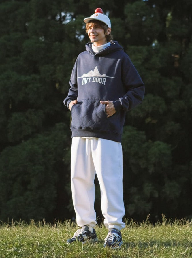 A guy wearing a white cap and Outdoor Hoodie