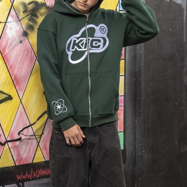 A boy posing while wearing the green Y2K Loose Hoodie