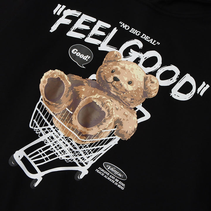 Details of the print of Feel Good Bear Print Hoodie showing a letter print saying " FEEL GOOD" with a teddy bear in a shopping cart below it
