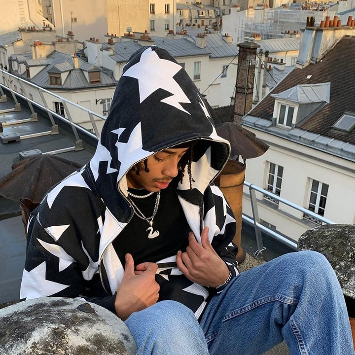 A model showing the details of the black Zip Up Grunge Hoodie while sitting on the roof of a building