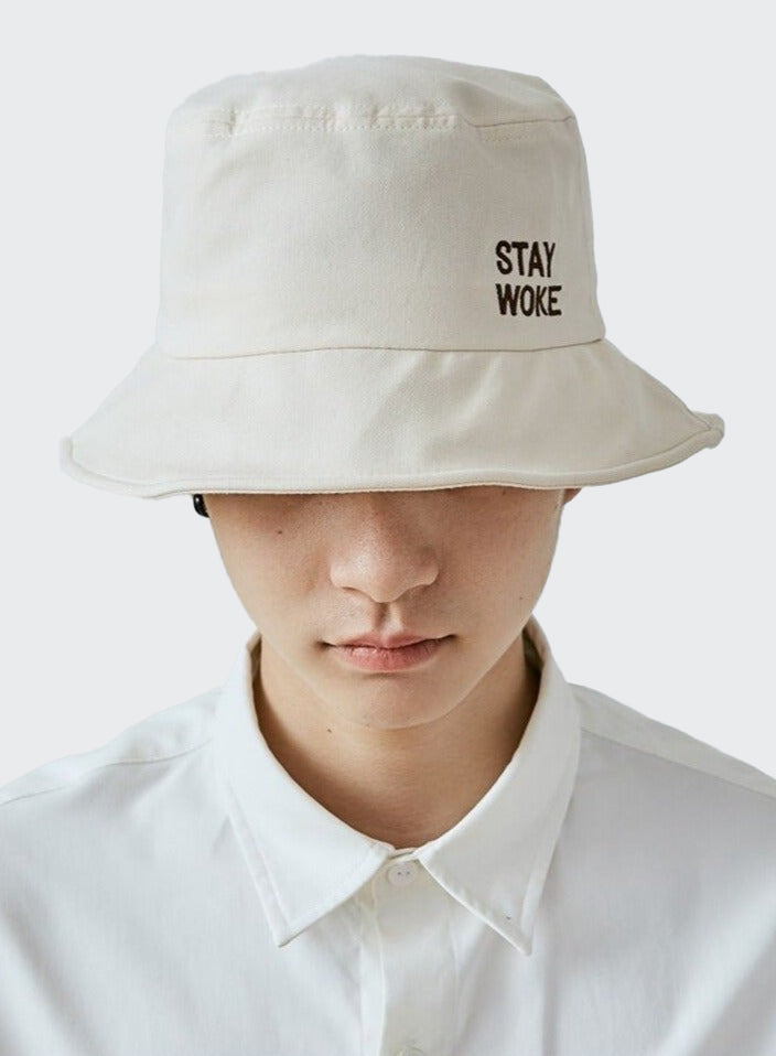 A guy wearing Stay Woke Bucket hat