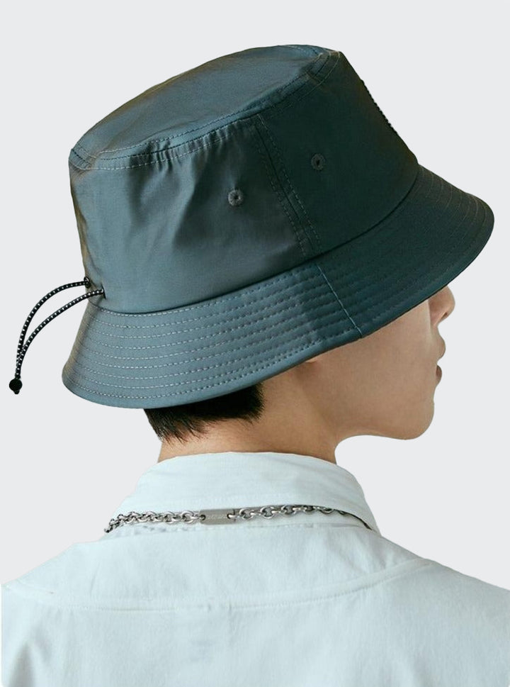 A guy wearing Reflective Japanese Fisherman Hat side view