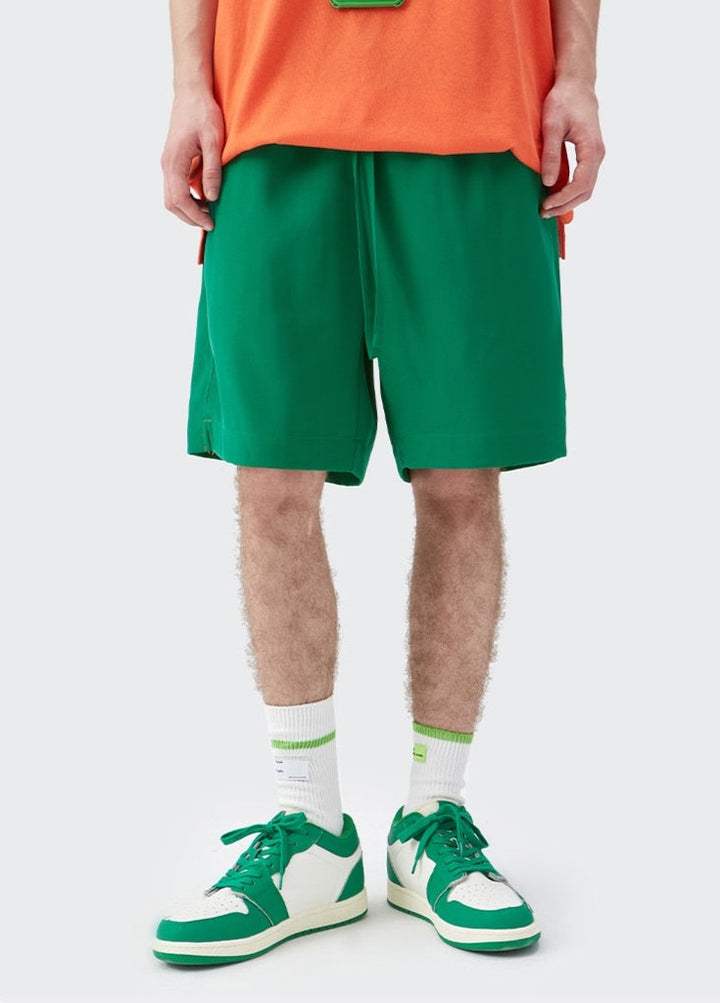 A guy wearing Green Loose Blank Jogger Short front view